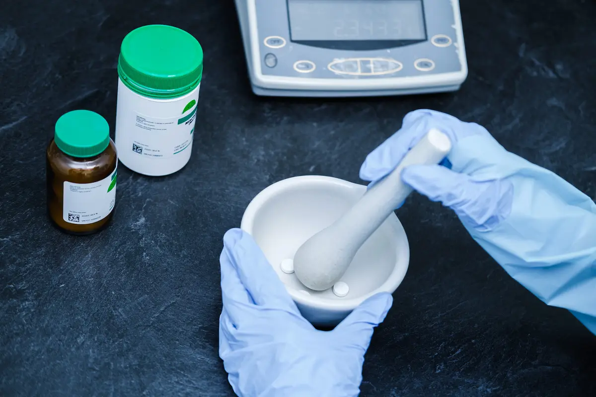 Pharmacist preparing a custom compounded medication